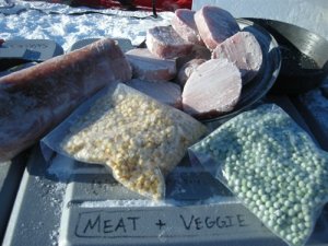 Local, farm raised, pork tenderloin and freeze dried organic vegetables laid out on top of our 'Meat and Veggies' crate.